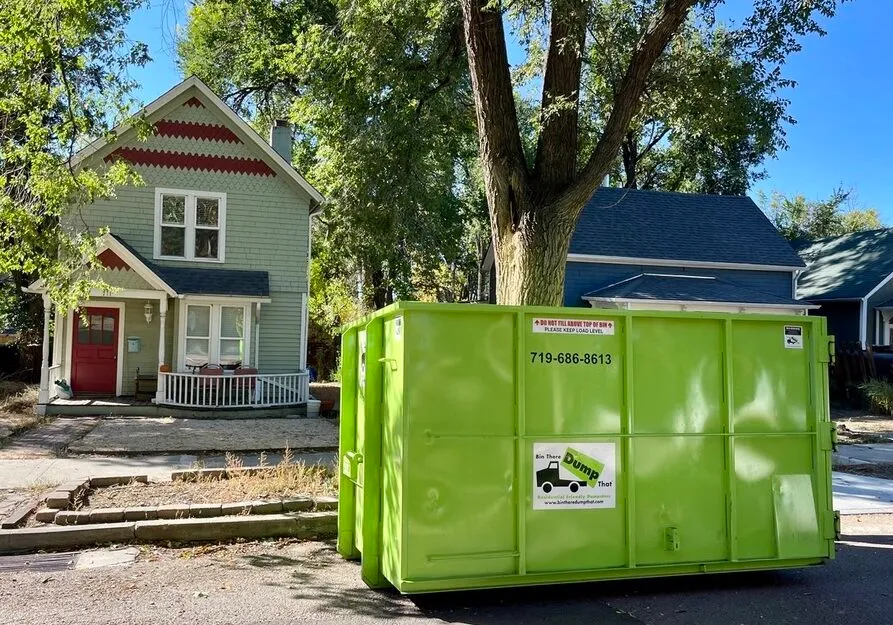 Dumpster in a Colorado Springs driveway